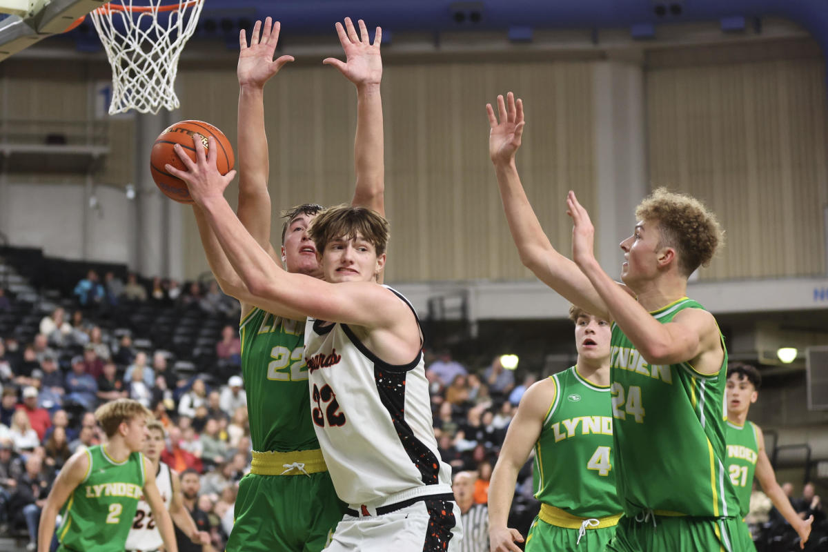 Zillah's Nic Navarre is defended by a pair of Lynden players during Thursday night's game at the SunDome Shootout in Yakima, Wash.