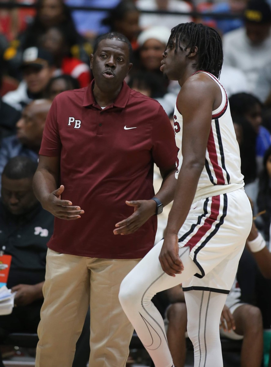 Pine Bluff head coach Billy Dixon talks with University of Missouri football signee Courtney Crutchfield during the Zebras' game against Duncanville on Wednesday. (Photo by Justin Manning)