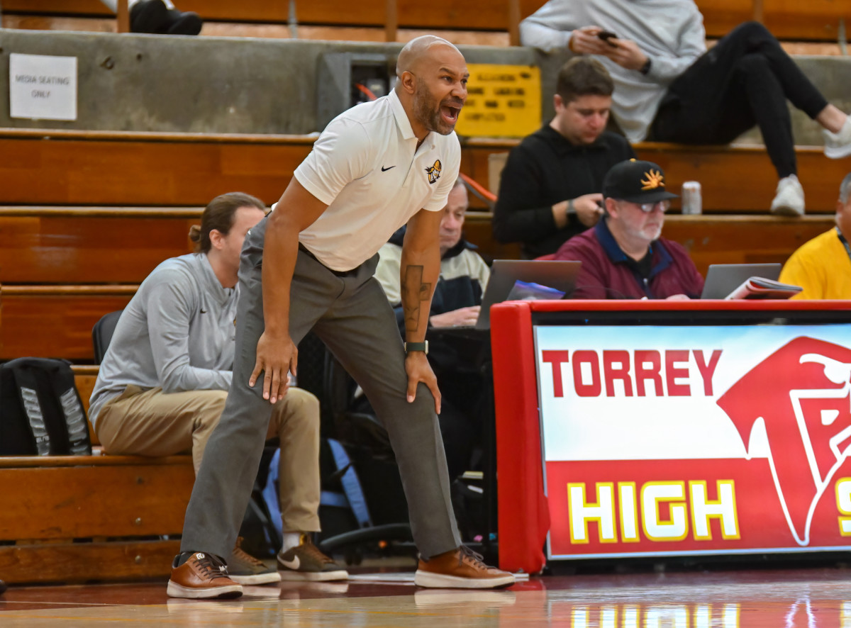 Crespi coach and former NBA guard Derek Fisher exalting his team during a back-and-forth game Saturday. 