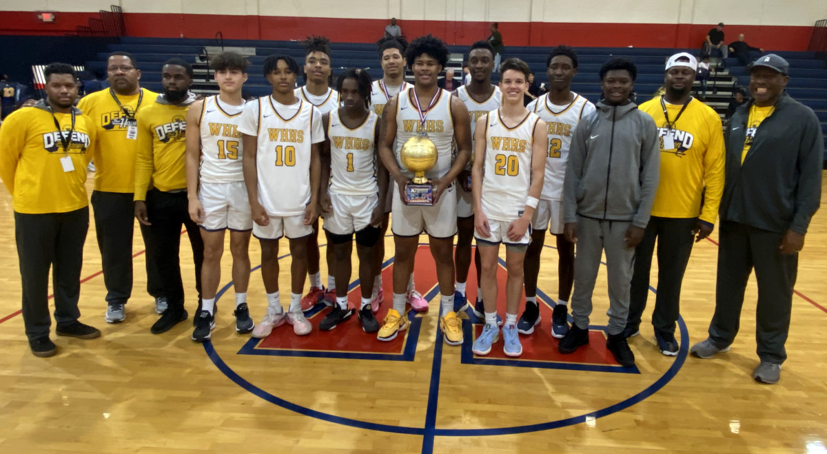 Winter Haven poses with its Kingdom in the Sun championship trophy on Saturday at the Kingdom in the Sun Tournament at Vanguard High School in Ocala. It was the Blue Devils second consecutive tournament trophy. 