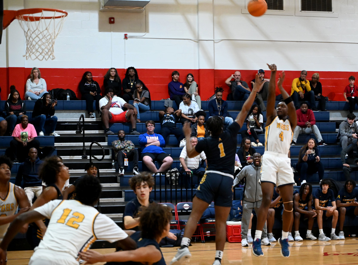 Winter Haven senior guard Isaac Celiscar fires up a jump shot during the first half of the championship game against St. Thomas Aquinas on Saturday at the Kingdom in the Sun Tournament at Vanguard High School in Ocala. 