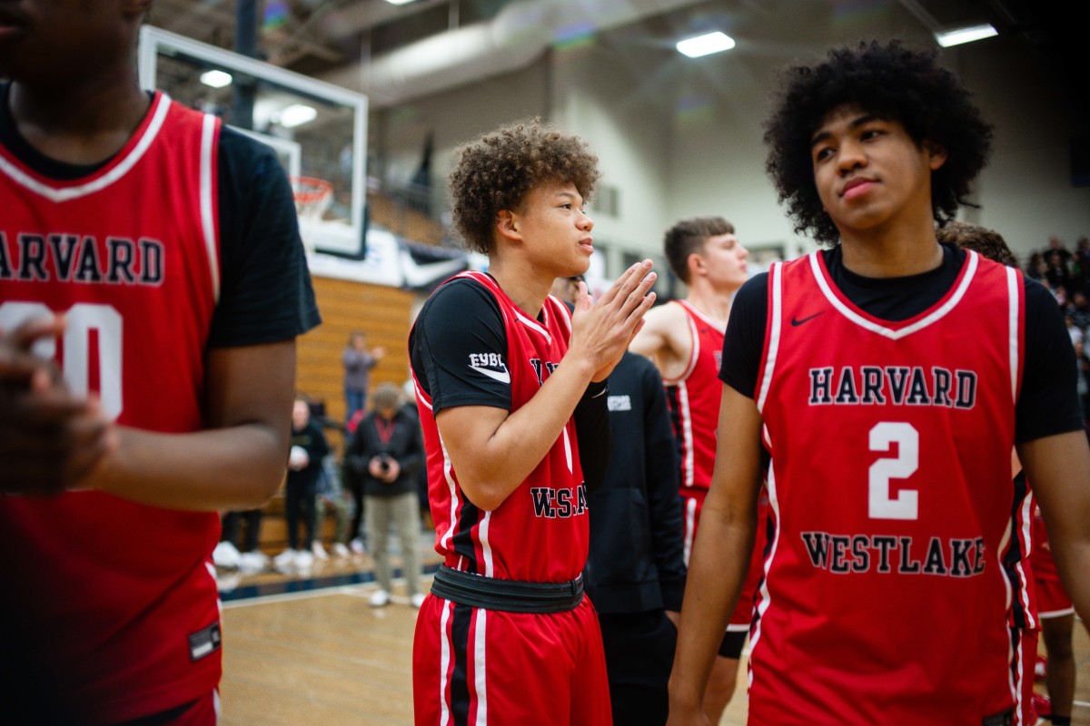 Harvard-Westlake senior Trent Perry (center) takes the court at the Les Schwab Invitational championship game on Dec. 30, 2023. 