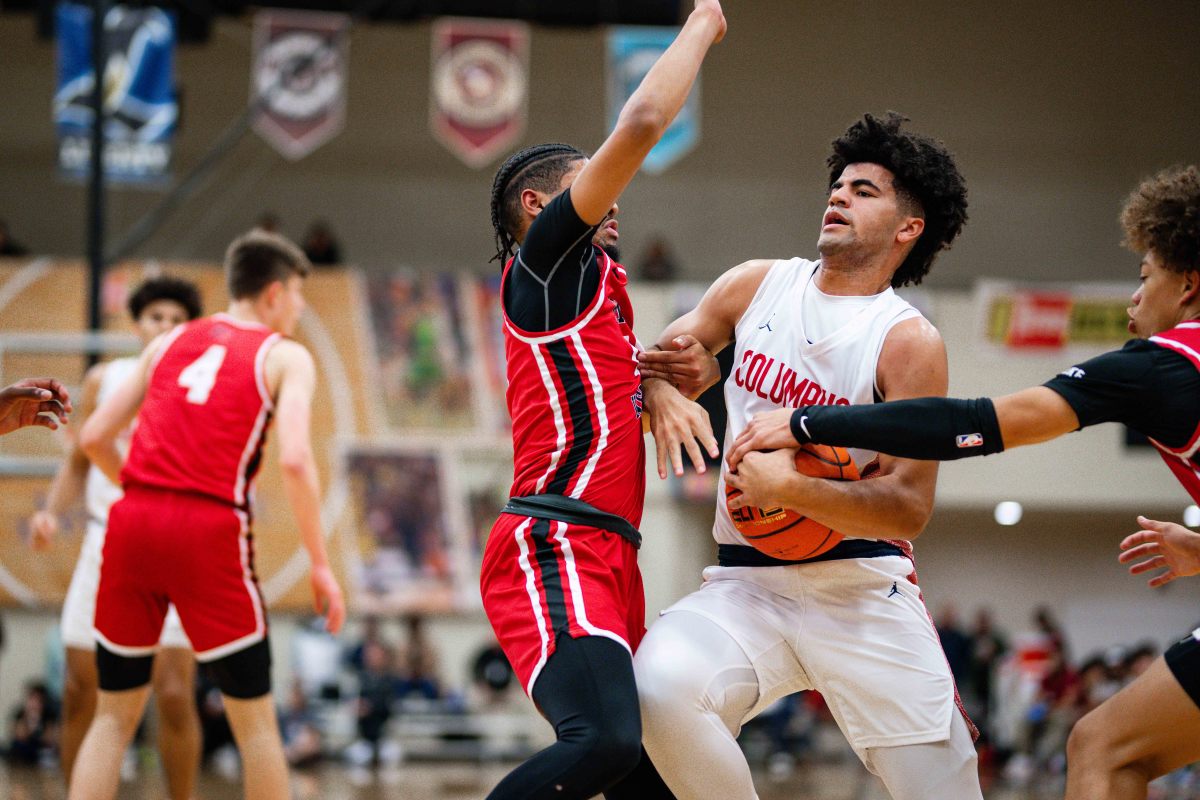 Columbus guard Cayden Boozer drives through traffic against Harvard-Westlake in the championship of the Les Schwab Invitational in Oregon in December. 
