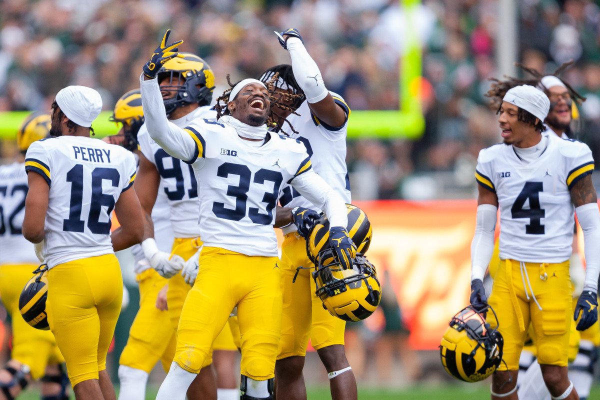 Oct 30, 2021; East Lansing, Michigan, USA; Michigan Wolverines defensive back German Green (33) dances with teammates as the fourth quarter begins against the Michigan State Spartans at Spartan Stadium. Mandatory Credit: Raj Mehta-USA TODAY Sports
