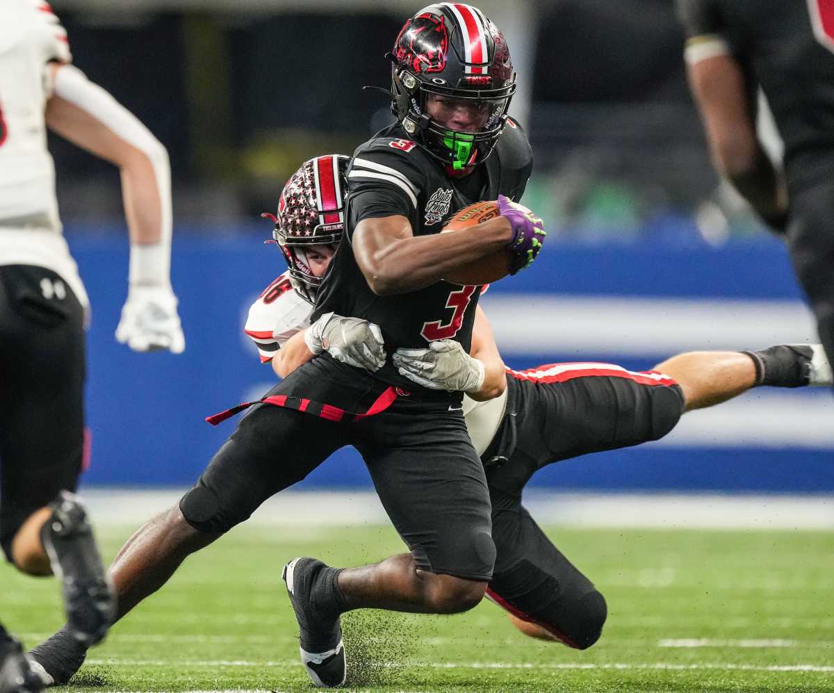 NorthWood's NiTareon Tuggle (3) is brought down during the in the IHSAA Class 4A football state championship game at Lucas Oil Stadium on Nov. 25.
