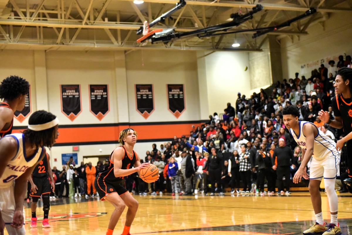 Oklahoma City Douglass player Davon Scott hit a free throw inside the final second to lift the Trojans past city rival Millwood, 52-51, on Jan. 13, 2024.