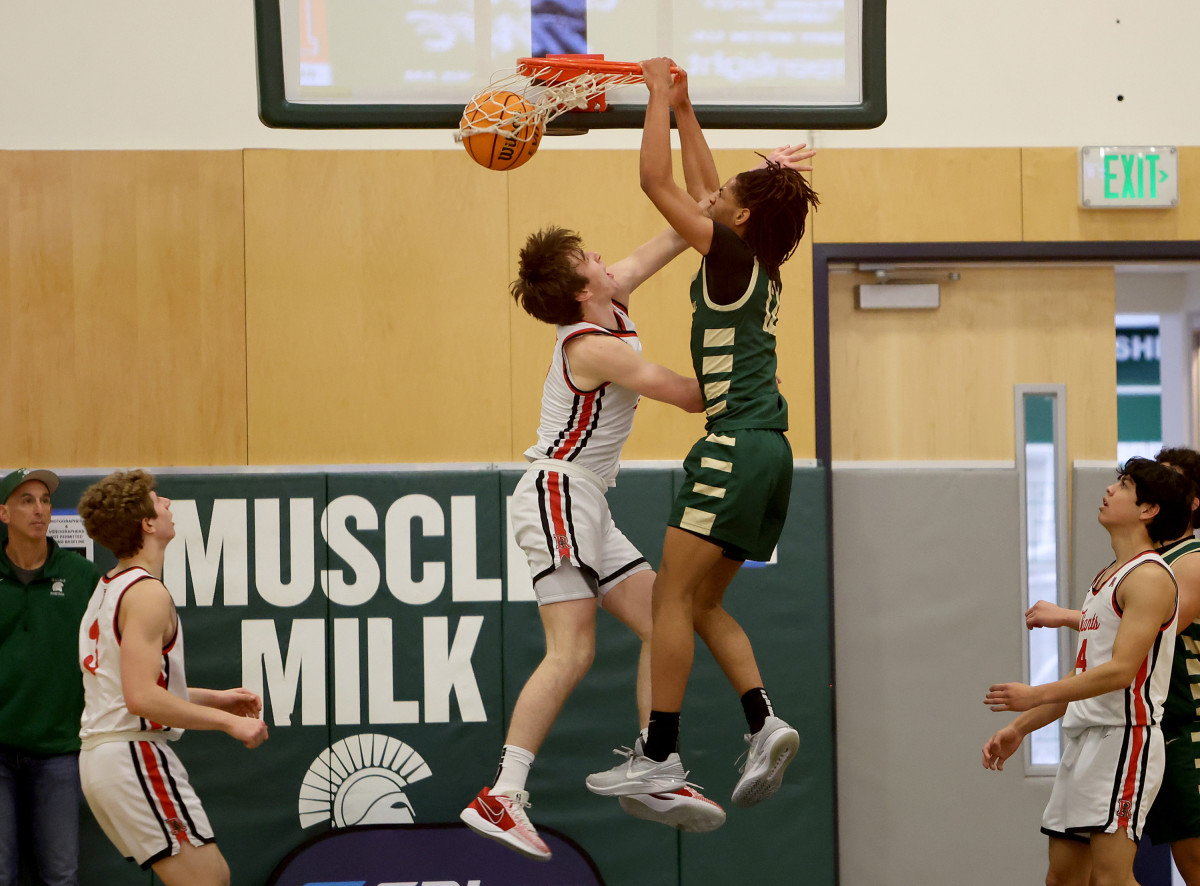 Cole Loud goes up for the second of back-to-back dunks for Moreau Catholic. 