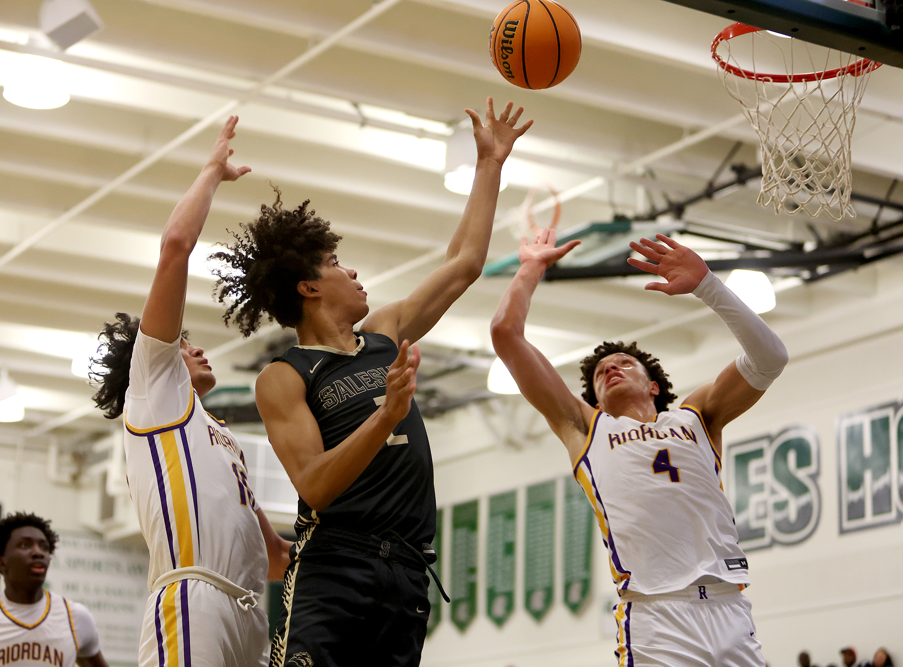 Great, intense action between Riordan and Salesian in the MLK Classic at De La Salle on Jan. 15. 