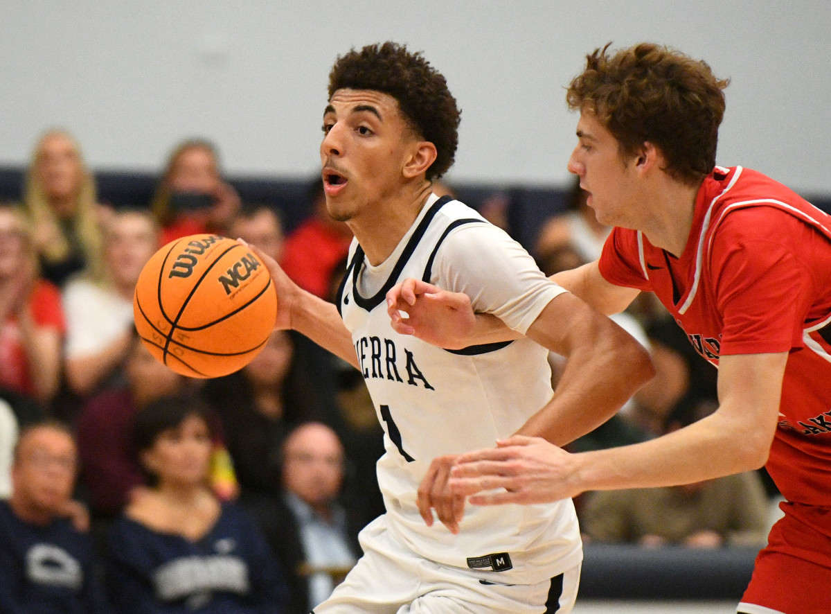 Sierra Canyon's Justin Pippen drives past a Harvard-Westlake defender on January 19th