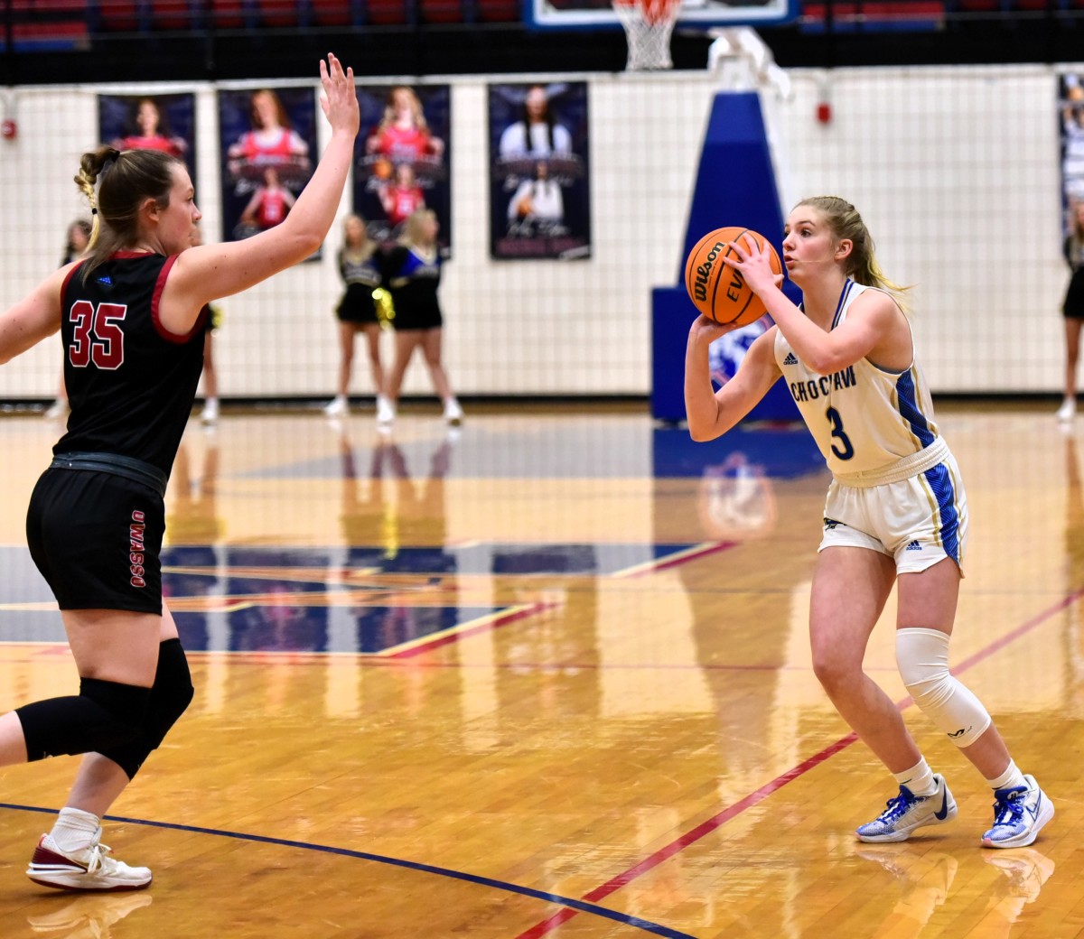 Choctaw's Katelyn Davis (right) attempts a 3-pointer during the Lady Yellowjackets' win against Owasso in the title game of the John Nobles Invitational at Moore on Jan. 20, 2024.