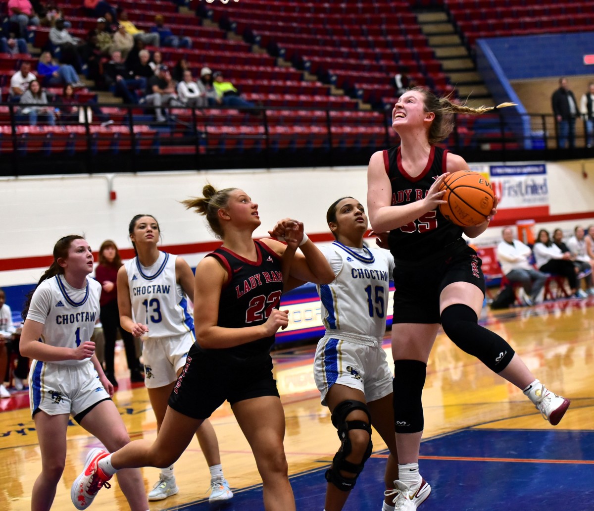 Owasso's Makenna Yokley (with ball) goes up for a basket during the title game of the John Nobles Invitational on Jan. 20, 2024, in Moore.