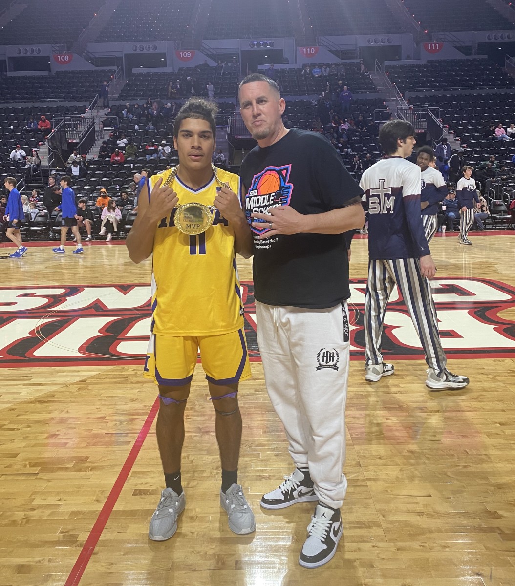 Iowa's Cohen Charles (left) poses with Brad Boyd, the organizer of the Cajundome Classic, on January 20, 2024. Charles was named the MVP of the Yellow Jackets' win against Lafayette Christian.
