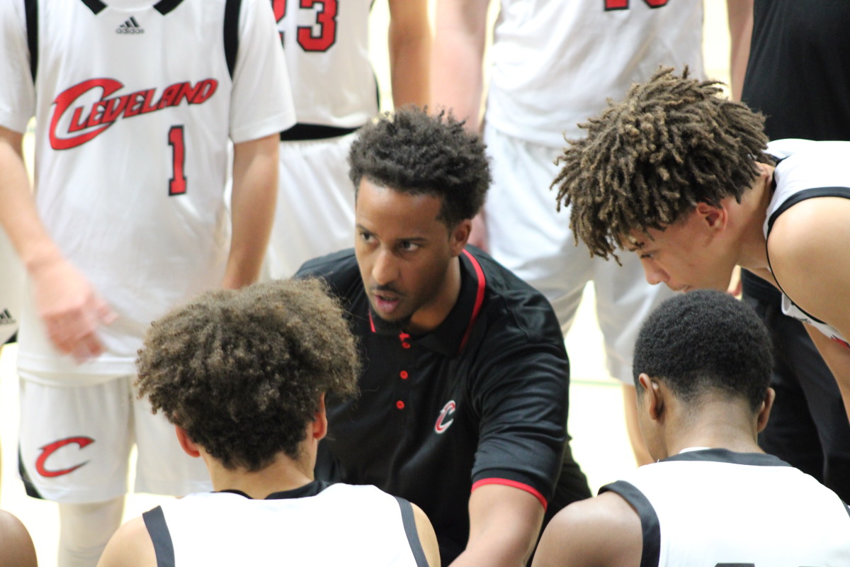 Cleveland coach Dagem Asfaw leads the huddle during a game at the Classic at Damien