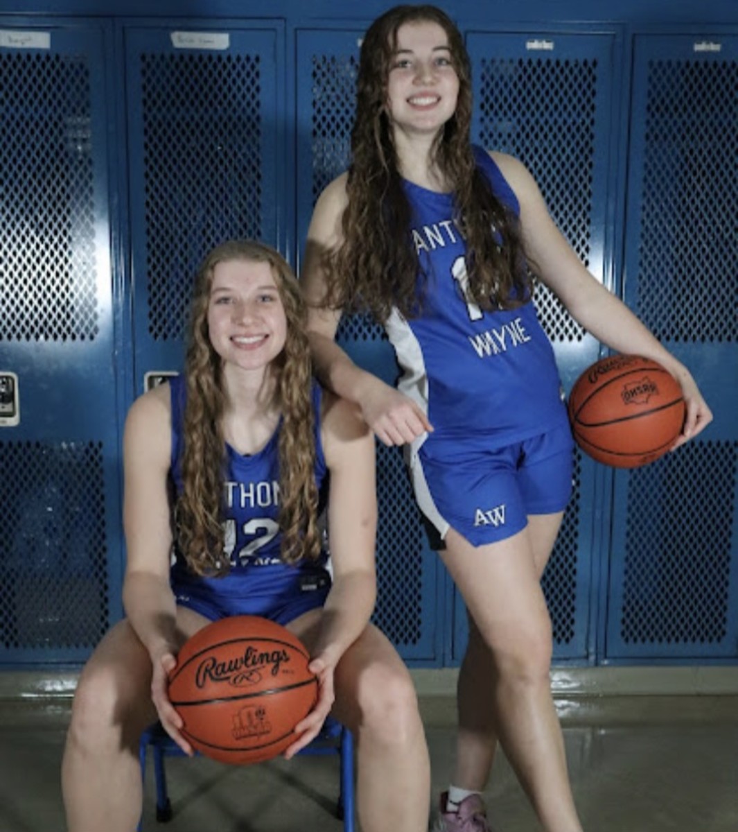 Elise Bender (No. 12) and Brooke Bender (No. 14) of Anthony Wayne girls basketball pose for a photo.