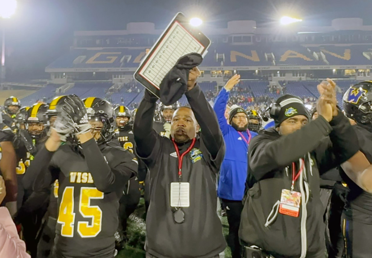 Henry A. Wise football coach DaLawn Parrish (center) acknowledges the fans after winning the Maryland Class 4A state title at Navy-Marine Corps Memorial Stadium early last month. After winning six state championships in 17 seasons at Wise, Parrish has stepped down. (Photo courtesy of Wise Athletics)