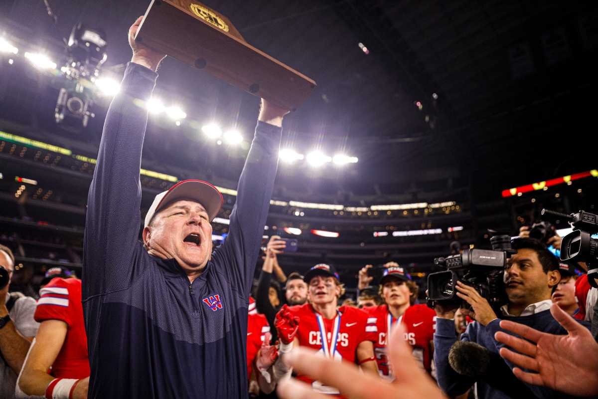 Westlake head coach Todd Dodge lifts the Class 6A Division II State Championship trophy after defeating Guyer 40-21 at AT&T Stadium in Arlington, Texas on Dec. 18, 2021