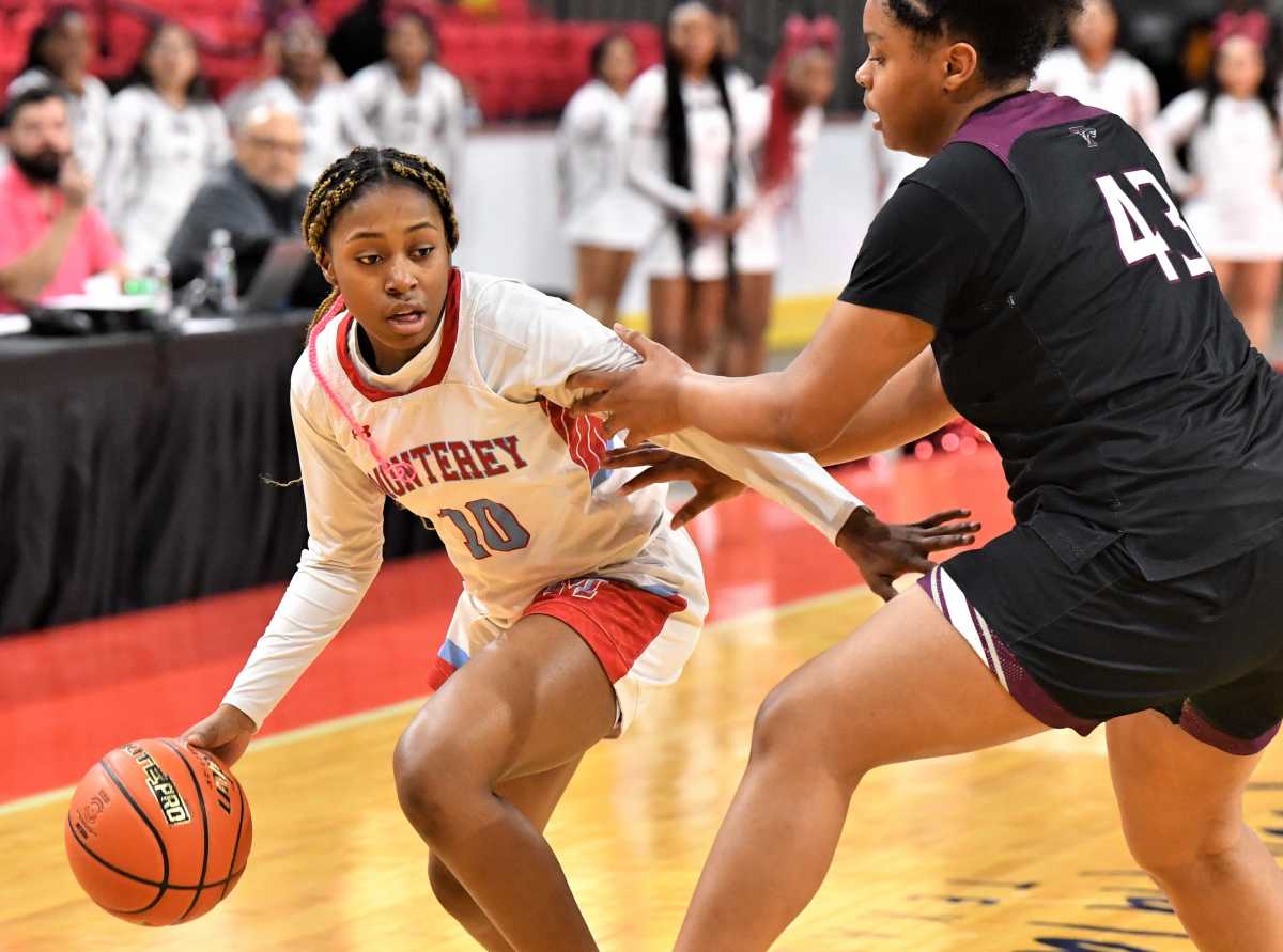 Lubbock-Monterey's Ambrosia Cole dribbles on Mansfield Timberview's Zoi McClellan during the 2023 UIL Region I-5A girls tournament.