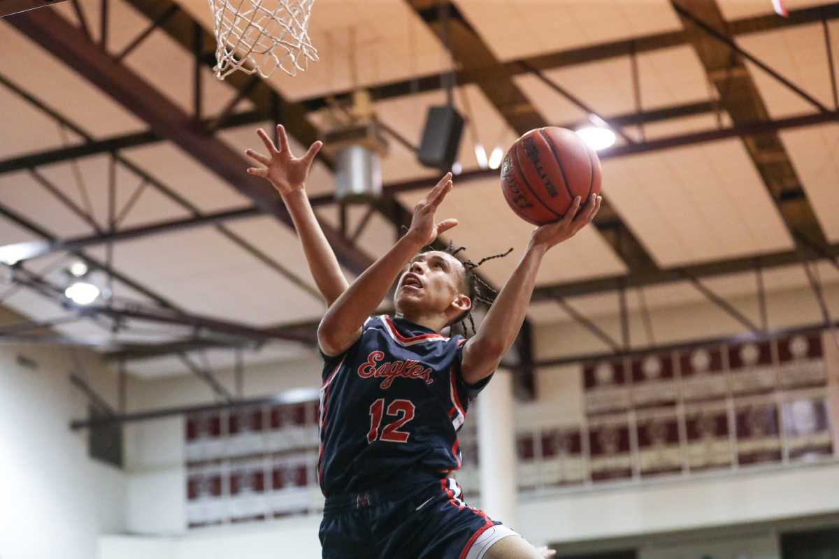 Veterans Memorial's Sean Mondragon attempts a contested layup during the game at Flour Bluff High School on Jan. 12.